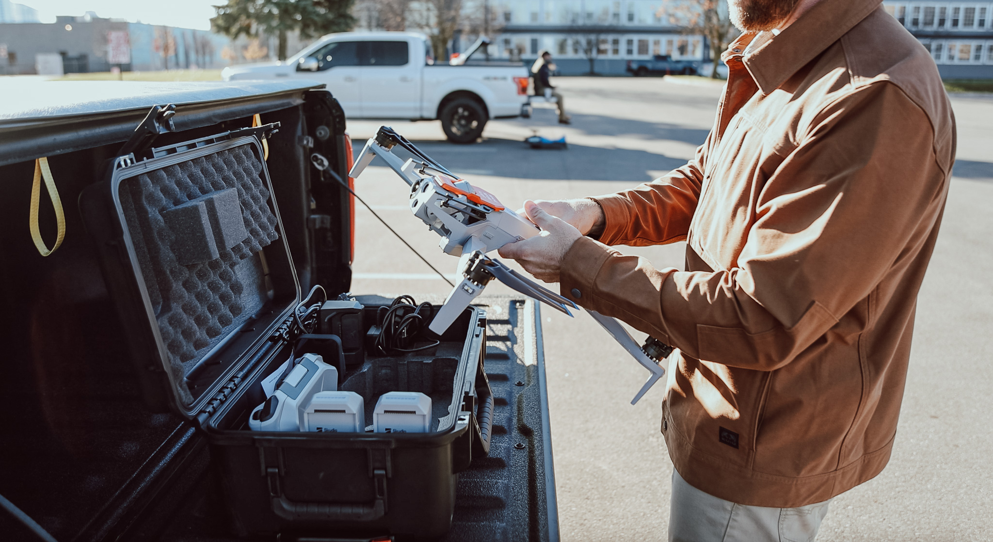 A drone operator preparing equipment for a Westwood AI project